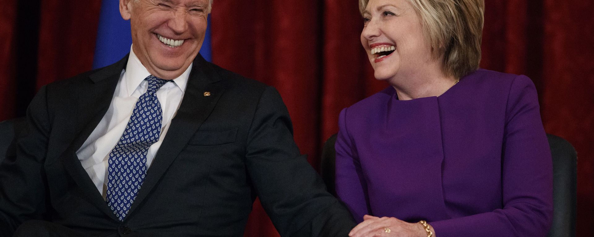 Vice President Joe Biden, left, laughs with former Secretary of State Hillary Clinton during a ceremony to unveil a portrait of Senate Minority Leader Harry Reid, D-Nev., on Capitol Hill, Thursday, Dec. 8, 2016, in Washington. Vice President Joe Biden, left, laughs with former Secretary of State Hillary Clinton during a ceremony to unveil a portrait of Senate Minority Leader Harry Reid, D-Nev., on Capitol Hill, Thursday, Dec. 8, 2016, in Washington. - Sputnik International, 1920, 20.05.2023