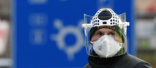 A Czech police officer, with a protective mask, waits during sanitary checks on drivers at the border crossing between Germany and Czech Republic, near the German village of Furth and the Czech village Nova Kubice in a measure to protect against the spread of the novel coronavirus, on March 9, 2020. A Czech police officer, with a protective mask, waits during sanitary checks on drivers at the border crossing between Germany and Czech Republic, near the German village of Furth and the Czech village Nova Kubice in a measure to protect against the spread of the novel coronavirus, on March 9, 2020. - Sputnik International
