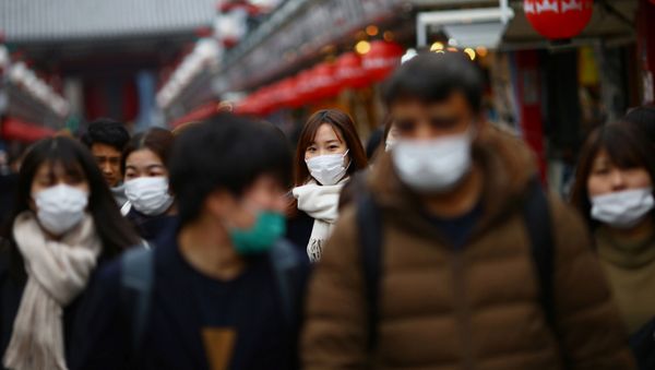 Tourists wearing protective face masks, following an outbreak of the coronavirus disease (COVID-19), visit Asakusa neighbourhood in Tokyo, Japan March 8, 2020 Tourists wearing protective face masks, following an outbreak of the coronavirus disease (COVID-19), visit Asakusa neighbourhood in Tokyo, Japan March 8, 2020 - Sputnik International