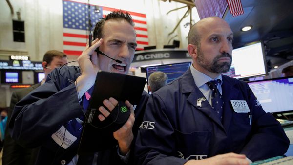 Traders work on the floor of the New York Stock Exchange (NYSE) in New York, U.S., March 12, 2020 - Sputnik International