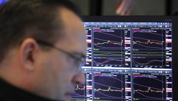 A trader works on the floor of the New York Stock Exchange (NYSE) after the opening bell of the trading session in New York, U.S., March 13, 2020 - Sputnik International