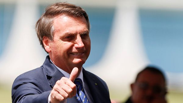 Brazil's President Jair Bolsonaro gestures as he leaves the Alvorada Palace after coronavirus reports in Brasilia, Brazil, March 13, 2020.  - Sputnik International
