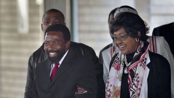 King Buyelekhaya Zwelibanzi Dalindyebo, left, the Xhosa king who rules the Thembu tribe to which the Mandela family belongs, escorts Nelson Mandela's former wife Winnie Madikizela-Mandela to her car, after they visited the Mediclinic Heart Hospital where former South African President Nelson Mandela is being treated in Pretoria, South Africa Tuesday, July 9, 2013. - Sputnik International