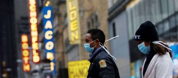 People in surgical masks walk through Manhattan's Broadway Theatre district People in surgical masks walk through Manhattan's Broadway Theatre district - Sputnik International