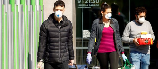 People wearing protective masks walk out of a supermarket, amidst concerns over Spain's coronavirus outbreak in central Madrid - Sputnik International