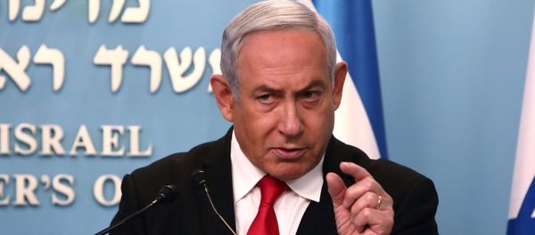 Israeli Prime Minister Benjamin Netanyahu gestures as he delivers a speech at his Jerusalem office, regarding the new measures that will be taken to fight the coronavirus, March 14, 2020. - Sputnik International