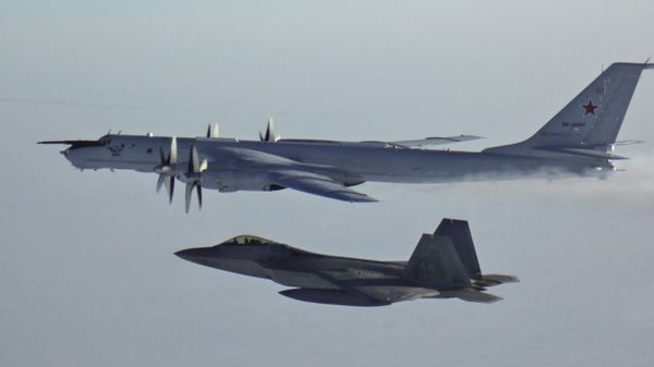 Russian Tu-142 maritime reconnaissance aircraft, top right, is intercepted near the Alaska coastline. - Sputnik International
