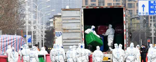 Workers in protective suits take part in the disinfection of Huanan seafood market, where the novel coronavirus is believed to have first surfaced, in Wuhan, Hubei province, China March 4, 2020. cnsphoto via REUTERS.  - Sputnik International