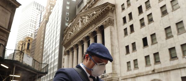 A man wears a protective mask as he walks past the New York Stock Exchange on the corner of Wall and Broad streets during the coronavirus outbreak in New York City, New York, U.S., March 13, 2020 A man wears a protective mask as he walks past the New York Stock Exchange on the corner of Wall and Broad streets during the coronavirus outbreak in New York City, New York, U.S., March 13, 2020 - Sputnik International