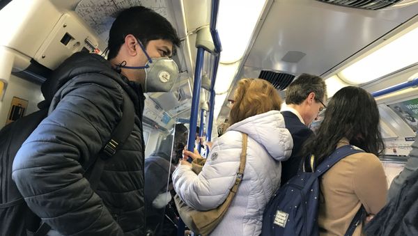 A man wears a mask on the London Underground amid the coronavirus outbreak A man wears a mask on the London Underground amid the coronavirus outbreak - Sputnik International