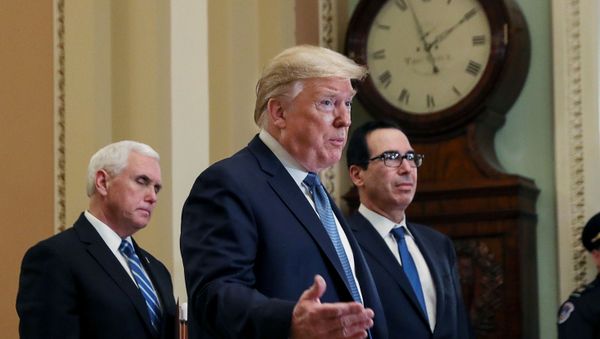 U.S. President Donald Trump is flanked by Vice President Mike Pence and Treasury Secretary Steven Mnuchin as he speaks to members of the news media following a closed Senate Republican policy lunch meeting to discuss the response to the coronavirus outbreak with senators on Capitol Hill in Washington, U.S., March 10, 2020 - Sputnik International