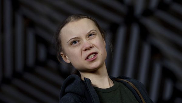Swedish climate activist Greta Thunberg speaks with the media as she arrives for a meeting of the Environment Council at the European Council building in Brussels, 5 March 2020 - Sputnik International