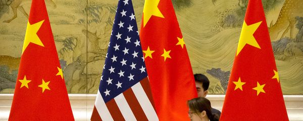 FILE - In this Feb. 14, 2019, file photo, Chinese staffers adjust U.S. and Chinese flags before the opening session of trade negotiations between U.S. and Chinese trade representatives at the Diaoyutai State Guesthouse in Beijing. Beijing on Friday, June 28, 2019 FILE - In this Feb. 14, 2019, file photo, Chinese staffers adjust U.S. and Chinese flags before the opening session of trade negotiations between U.S. and Chinese trade representatives at the Diaoyutai State Guesthouse in Beijing. Beijing on Friday, June 28, 2019 - Sputnik International