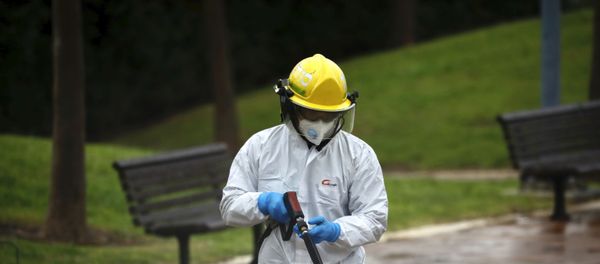 An Israeli firefighter sprays disinfectant in Modi'in, Israel An Israeli firefighter sprays disinfectant in Modi'in, Israel - Sputnik International
