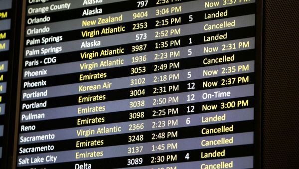 Several canceled flights are pictured on a monitor at Seattle-Tacoma International Airport as airlines are reeling from a plunge in bookings and traffic, as the fast-spreading coronavirus pandemic has prompted travel restrictions and event cancellations around the world, 13 March 2020 - Sputnik International