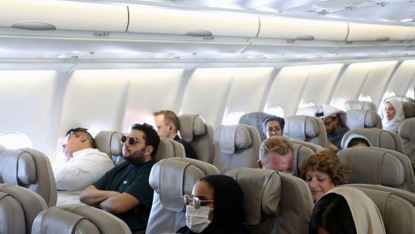 Passengers wear protective face masks following an outbreak of coronavirus, on a plane of Saudi Airlines, during their trip to al-Ula to attend the Tantura Festival, Saudi Arabia March 6, 2020 - Sputnik International