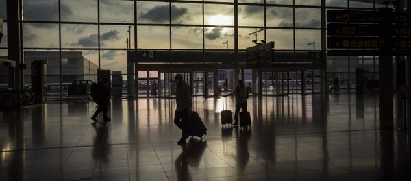 Passengers walk in an empty terminal at the airport of Barcelona, Spain, Thursday, March 19, 2020 Passengers walk in an empty terminal at the airport of Barcelona, Spain, Thursday, March 19, 2020 - Sputnik International