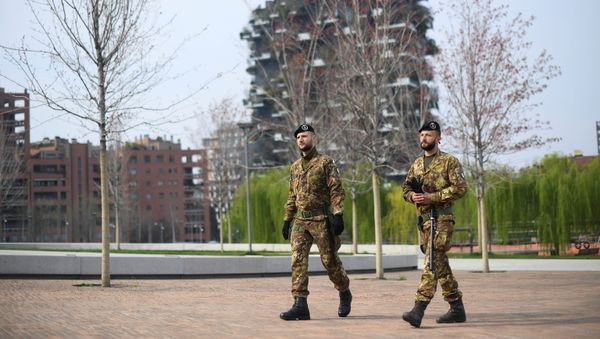 Italian army soldiers patrol streets after being deployed to the region of Lombardy to enforce the lockdown against the spread of coronavirus disease (COVID-19) in Milan, Italy, March 20, 2020 Italian army soldiers patrol streets after being deployed to the region of Lombardy to enforce the lockdown against the spread of coronavirus disease (COVID-19) in Milan, Italy, March 20, 2020 - Sputnik International