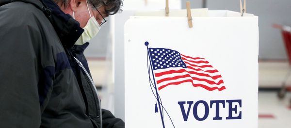 Voter Fred Hoffman fills out his ballot during the primary election in Ottawa, Illinois, U.S., March 17, 2020. The polling station was relocated from a nearby nursing home to a former supermarket due to concerns over the outbreak of coronavirus disease (COVID-19). Voter Fred Hoffman fills out his ballot during the primary election in Ottawa, Illinois, U.S., March 17, 2020. The polling station was relocated from a nearby nursing home to a former supermarket due to concerns over the outbreak of coronavirus disease (COVID-19). - Sputnik International