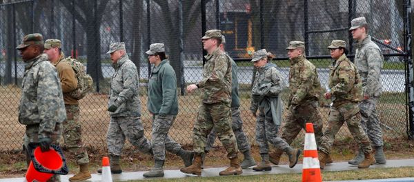 U.S. military personnel walk outside a new coronavirus testing center in the Staten Island borough of New York City, New York, U.S., March 19, 2020 U.S. military personnel walk outside a new coronavirus testing center in the Staten Island borough of New York City, New York, U.S., March 19, 2020 - Sputnik International