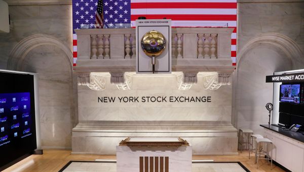 The bell used to open and close the markets hangs in front of an empty podium above the floor of the New York Stock Exchange (NYSE) as it prepares to close due to the coronavirus disease (COVID-19) outbreak in New York, U.S., 20 March, 2020 - Sputnik International