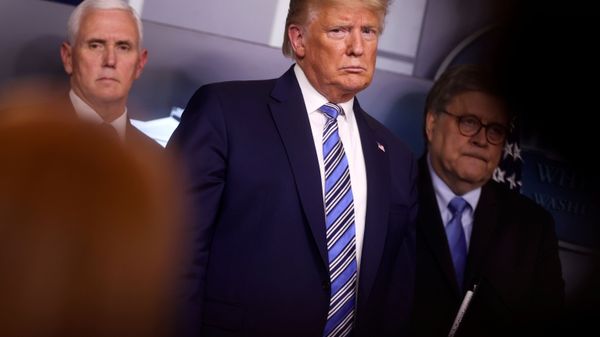 U.S. President Donald Trump looks at a reporter asking a question as he stands with Vice President Mike Pence and Attorney General William Barr during the coronavirus response daily briefing at the White House in Washington, U.S., March 23, 2020. U.S. President Donald Trump looks at a reporter asking a question as he stands with Vice President Mike Pence and Attorney General William Barr during the coronavirus response daily briefing at the White House in Washington, U.S., March 23, 2020. - Sputnik International