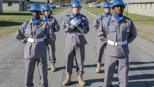The Georgia National Guard Youth Challenge Academy Color Guard awaits the beginning of the academy's family day activities. Students are selected to the color guard after a rigorous assessment of their knowledge, physical fitness and leadership abilities. - Sputnik International