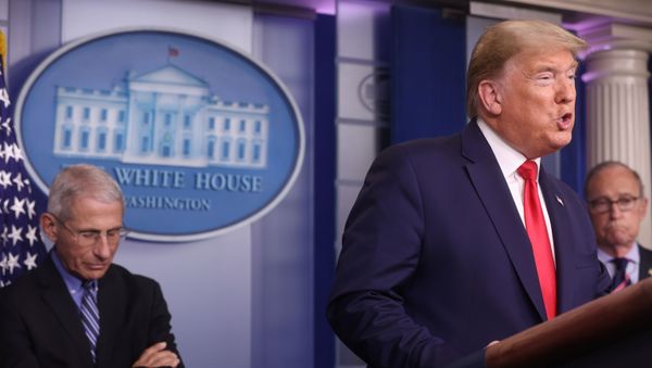  U.S. President Donald Trump addresses the coronavirus task force daily briefing as as National Institute of Allergy and Infectious Diseases Director Anthony Fauci listens at the White House in Washington, U.S., March 24, 2020 - Sputnik International