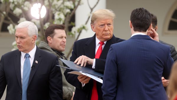 U.S. President Donald Trump stands with Vice President Mike Pence as he prepares to participate in a televised Fox News Channel “virtual town hall” on the coronavirus response in the Rose Garden of White House in Washington, U.S. March 24, 2020.  - Sputnik International