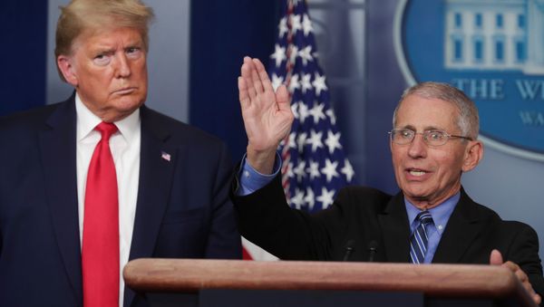 U.S. President Donald Trump listens as Dr. Anthony Fauci, Director of the National Institute of Allergy and Infectious Diseases, addresses the coronavirus task force daily briefing at the White House in Washington, U.S., March 24, 2020. - Sputnik International
