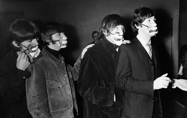 The Beatles are wearing the masks against the effects of fog. The famous beat group from Liverpool--George Harrison, Ringo Starr, John Lennon, and Paul McCartney , from left to right as they arrived for a concert in Ardwick, Manchester, December 7, 1965 wearing masks. The Beatles are wearing the masks against the effects of fog. The famous beat group from Liverpool--George Harrison, Ringo Starr, John Lennon, and Paul McCartney , from left to right as they arrived for a concert in Ardwick, Manchester, December 7, 1965 wearing masks. - Sputnik International