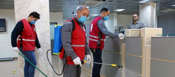 Members of Red Crescent spray disinfectants, as part of precautionary measures against coronavirus disease (COVID-19) at government offices in Misrata, Libya March 21, 2020. Picture taken March 21, 2020 Members of Red Crescent spray disinfectants, as part of precautionary measures against coronavirus disease (COVID-19) at government offices in Misrata, Libya March 21, 2020. Picture taken March 21, 2020 - Sputnik International