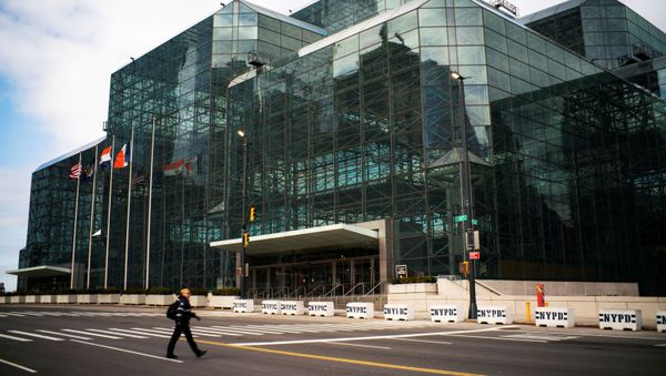 A woman walks by the Javits Convention Center as the coronavirus disease (COVID-19) outbreak continues in New York, U.S., March 22, 2020 A woman walks by the Javits Convention Center as the coronavirus disease (COVID-19) outbreak continues in New York, U.S., March 22, 2020 - Sputnik International