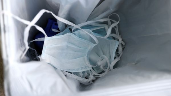 Used protective masks are seen in a bin at a laboratory where a fast test for coronavirus is performed, as the spread of the coronavirus disease (COVID-19) continues, in Frankfurt, Germany, March 31, 2020Used protective masks are seen in a bin at a laboratory where a fast test for coronavirus is performed, as the spread of the coronavirus disease (COVID-19) continues, in Frankfurt, Germany, March 31, 2020 - Sputnik International