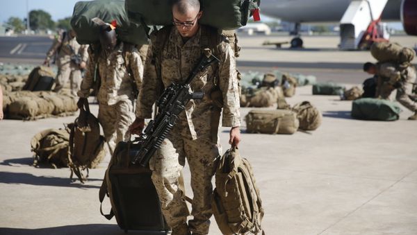 U.S. Marines and Sailors with Marine Rotational Force – Darwin 2018 collect their luggage and proceed to customs after arriving at the Royal Australian Air Force Base Darwin, Australia, April 17 - Sputnik International