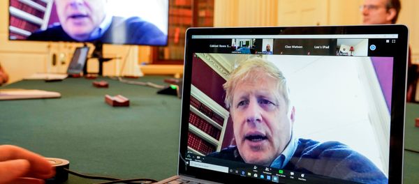 Britain's Prime Minister Boris Johnson appears on monitors for the coronavirus disease (COVID-19) meeting in London, Britain March 28, 2020. The prime minister chairs the morning update meeting on the coronavirus remotely from Number 11 Downing Street, since self-isolating after testing positive for the virus. - Sputnik International