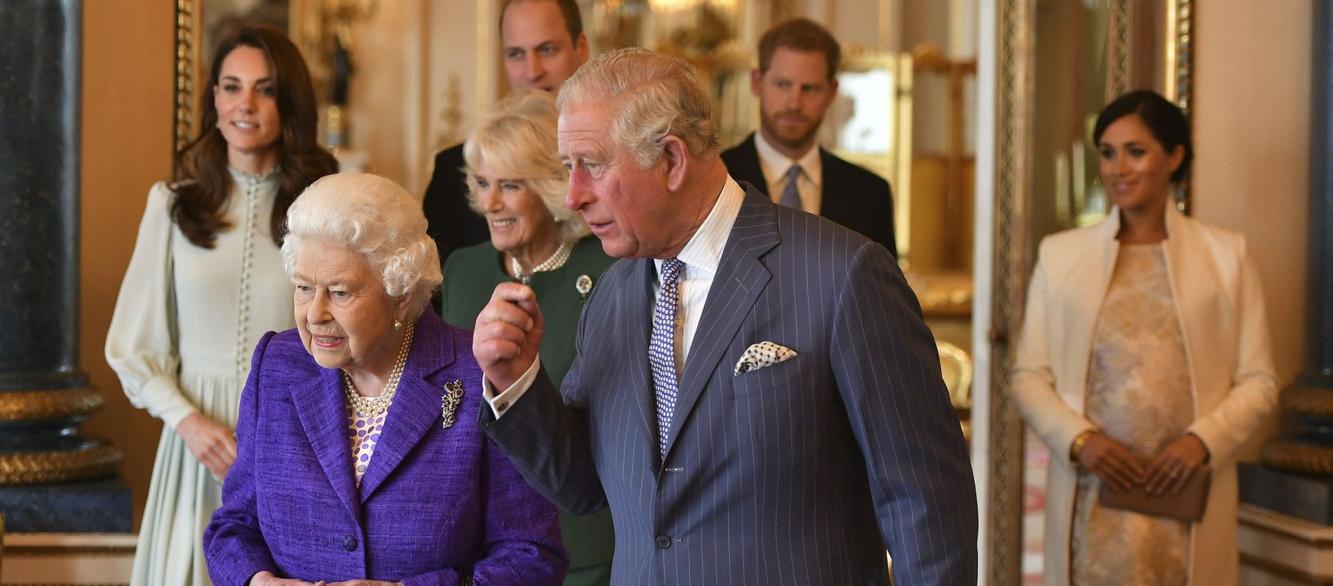 Queen Elizabeth II is joined by Prince Charles, the Prince of Wales, and behind from left, Kate, Duchess of Cambridge, Camilla, Duchess of Cornwall, Prince William, Prince Harry and Meghan, Duchess of Sussex during a reception at Buckingham Palace, London, Tuesday 5 March 2019, to mark the 50th anniversary of the Prince of Wales' investiture. Queen Elizabeth II is joined by Prince Charles, the Prince of Wales, and behind from left, Kate, Duchess of Cambridge, Camilla, Duchess of Cornwall, Prince William, Prince Harry and Meghan, Duchess of Sussex during a reception at Buckingham Palace, London, Tuesday 5 March 2019, to mark the 50th anniversary of the Prince of Wales' investiture. - Sputnik International, 1920, 09.03.2021
