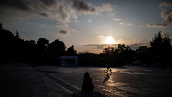A woman sits outside the Panathenaic stadium, during a nationwide lockdown to contain the spread of the coronavirus disease (COVID-19), in Athens, Greece, 29 March 2020. A woman sits outside the Panathenaic stadium, during a nationwide lockdown to contain the spread of the coronavirus disease (COVID-19), in Athens, Greece, 29 March 2020. - Sputnik International