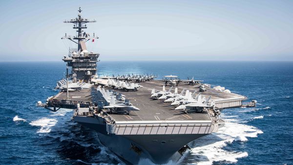 This US Navy file handout photo shows the aircraft carrier USS Theodore Roosevelt (CVN 71)as it transits the Pacific Ocean while conducting a tailored ship’s training availability off the coast of Southern California on April 30, 2017. - Sputnik International