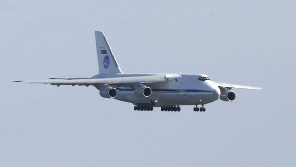 A Russian military transport plane carrying medical equipment, masks and supplies lands at JFK International Airport during the outbreak of the coronavirus disease (COVID-19) in New York City, New York, U.S., April 1, 2020 - Sputnik International