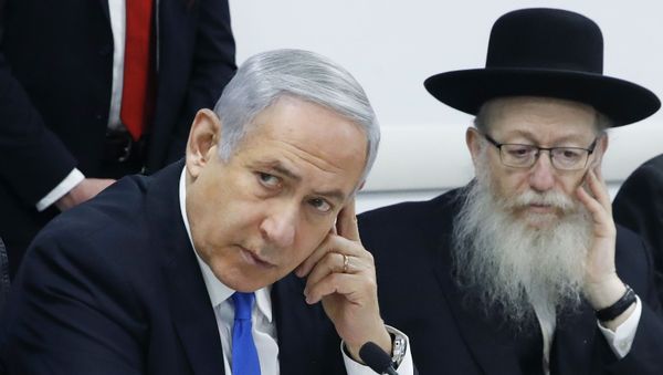Israeli Prime Minister Benjamin Netanyahu, left, holds a situation assessment meeting with Health Minister Yaakov Litzman and others regarding the Coronavirus (COVID-2019), at the Health Ministry in Tel Aviv, Israel, Sunday, Feb. 23, 2020 - Sputnik International