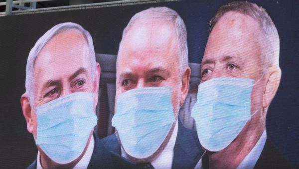 Israeli Prime Minister Benjamin Netanyahu, left, Israeli Former Defense Minister and leader of the Yisrael Beiteinu (Israel Our Home) right-wing party Avigdor Lieberman, center, and Blue and White party leader Benny Gantz, are shown on a billboard wearing masks in the Israeli city of Ramat Gan, near Tel Aviv, Sunday, March 29, 2020. Israeli Prime Minister Benjamin Netanyahu, left, Israeli Former Defense Minister and leader of the Yisrael Beiteinu (Israel Our Home) right-wing party Avigdor Lieberman, center, and Blue and White party leader Benny Gantz, are shown on a billboard wearing masks in the Israeli city of Ramat Gan, near Tel Aviv, Sunday, March 29, 2020. - Sputnik International