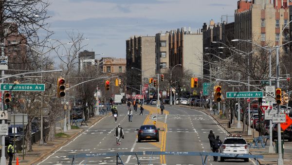 People walk on a temporarily closed section of the Grand Concourse during the outbreak of the coronavirus disease (COVID-19) in the Bronx borough of New York City, New York, U.S., April 2, 2020 People walk on a temporarily closed section of the Grand Concourse during the outbreak of the coronavirus disease (COVID-19) in the Bronx borough of New York City, New York, U.S., April 2, 2020 - Sputnik International
