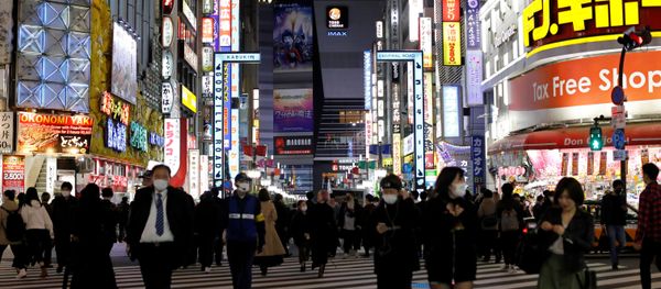 Passersby wearing protective face masks, following an outbreak of the coronavirus disease (COVID-19), walk at Kabukicho entertainment and shopping district in Tokyo, Japan Passersby wearing protective face masks, following an outbreak of the coronavirus disease (COVID-19), walk at Kabukicho entertainment and shopping district in Tokyo, Japan - Sputnik International