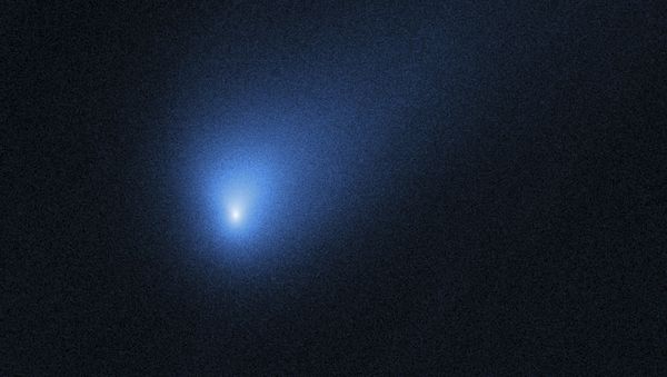 This Oct. 12, 2019 photo made available by NASA shows the comet 2I/Borisov, seen by the Hubble Space Telescope. It’s the second known interstellar visitor to swoop through our backyard. An amateur astronomer from Crimea, Gennady Borisov, discovered the comet in August, two years after the first alien guest, a cigar-shaped rock, popped up - Sputnik International
