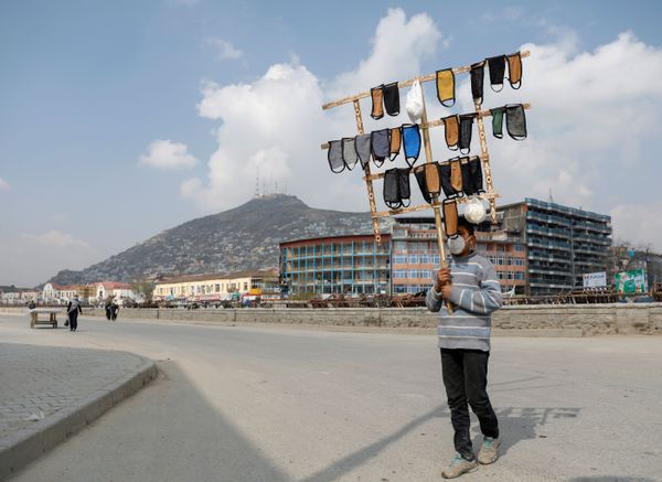 An Afghan boy holds protective face masks for sale in downtown, during the coronavirus disease (COVID-19) outbreak in Kabul, Afghanistan March 29, 2020 An Afghan boy holds protective face masks for sale in downtown, during the coronavirus disease (COVID-19) outbreak in Kabul, Afghanistan March 29, 2020 - Sputnik International