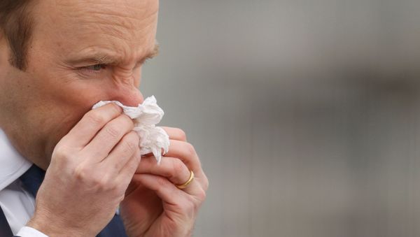Health Secretary Matt Hancock blows his nose at the NHS Nightingale Hospital as the spread of the coronavirus disease (COVID-19) continues - Sputnik International