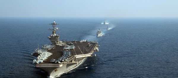 This US Navy photo obtained April 11, 2018 shows The aircraft carrier USS Theodore Roosevelt (CVN 71) leading a formation of US and Republic of Singapore navy ships during a photo exercise in the South China Sea on April 6, 2018 This US Navy photo obtained April 11, 2018 shows The aircraft carrier USS Theodore Roosevelt (CVN 71) leading a formation of US and Republic of Singapore navy ships during a photo exercise in the South China Sea on April 6, 2018 - Sputnik International