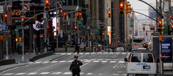 A New York City Police officer (NYPD) takes a selfie while in the middle of the street in an almost empty Times Square A New York City Police officer (NYPD) takes a selfie while in the middle of the street in an almost empty Times Square - Sputnik International