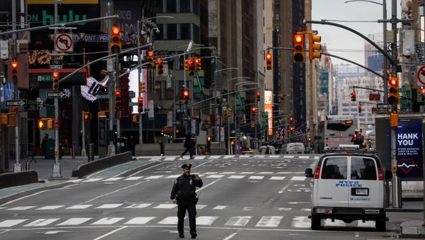 A New York City Police officer (NYPD) takes a selfie while in the middle of the street in an almost empty Times Square A New York City Police officer (NYPD) takes a selfie while in the middle of the street in an almost empty Times Square - Sputnik International